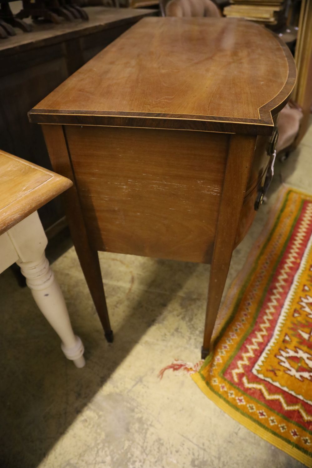 A Regency rosewood banded mahogany bow front sideboard, width 108cm, depth 53cm, height 92cm